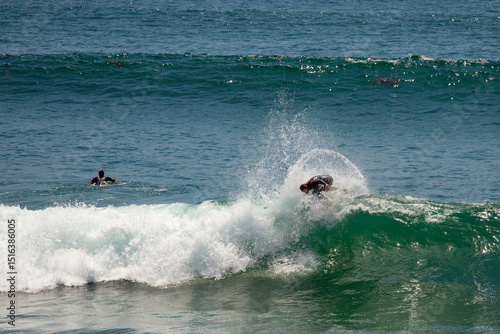 Surfer on the crest of a wave