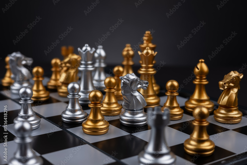 Golden and silver chess include king queen horse ship and pawn on dark background Golden and silver chess include king queen horse ship and pawn on dark background