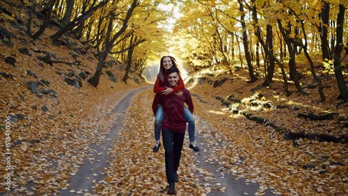 Wallpaper Mural Couple walk on autumn forest path. Leaves fall under their feet. Happy couple walk in forest. Romance in forest season. Autumn couple walk through golden leaves. Couple enjoy autumn forest walk Torontodigital.ca