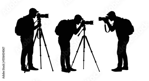 Three photographers taking photos with tripods.