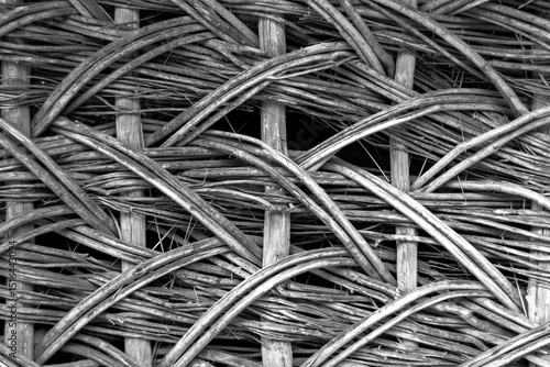 Abstract vine texture. The texture formed by the interweaving of thin vine rods. Template for interior design, websites or promotional materials. Horizontal image.