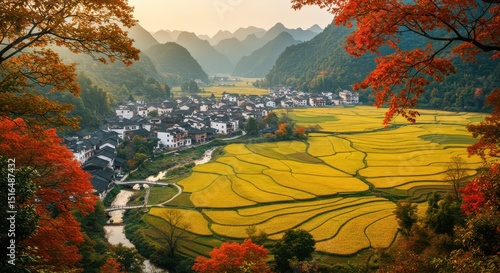 Scenic autumn valley with golden fields, town, river, hills and colorful trees