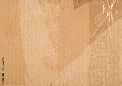 Brown paper textured box. Old dirty cardboard surface background. Corrugated cardboard sheet with clear tape.