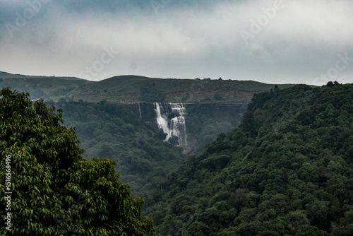 Dainthlen waterfall of Meghalaya, a Majestic multi-tiered waterfall cascading through dense forest, captured in serene wilderness.