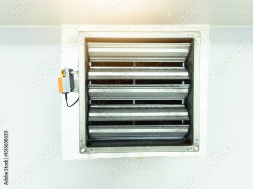 Close up the air damper actuator with automation open  close  damper blades on the ventilation duct.
