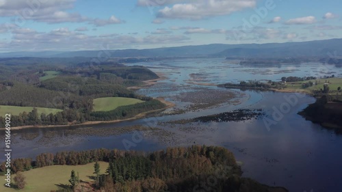 Winding River Through Wetlands and Farmland – Aerial View in Southern Chile