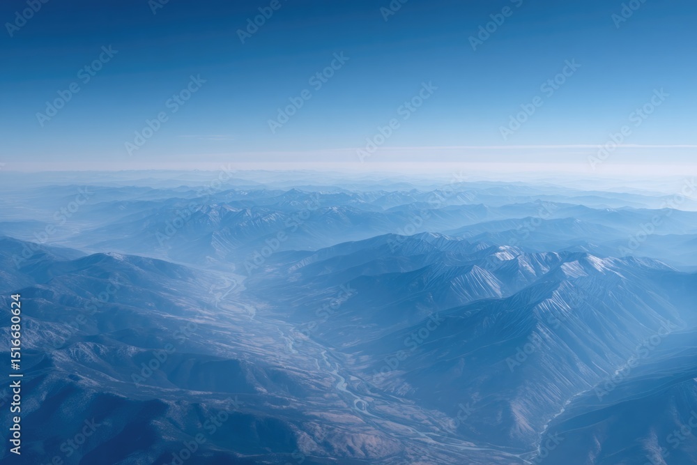 Fototapeta premium aerial view showcasing vast mountain range with winding rivers capturing expanse from above