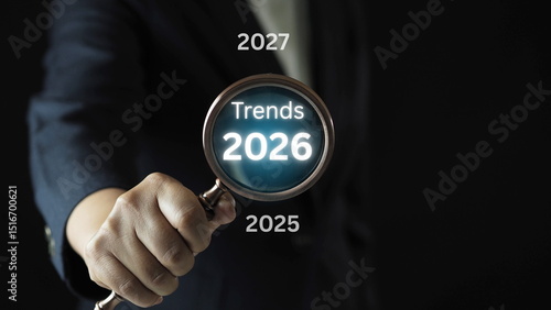 Wallpaper Mural Businessman analyzing trends 2026 with magnifying glass strategic growth planning and digital innovation for business development Torontodigital.ca