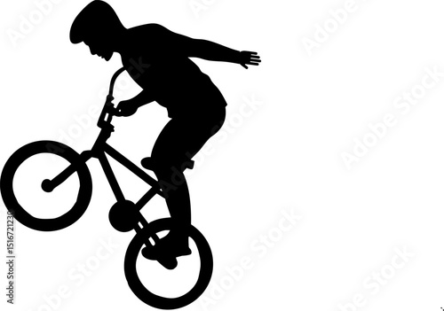 teen on bicycle performing stunt in urban light.eps