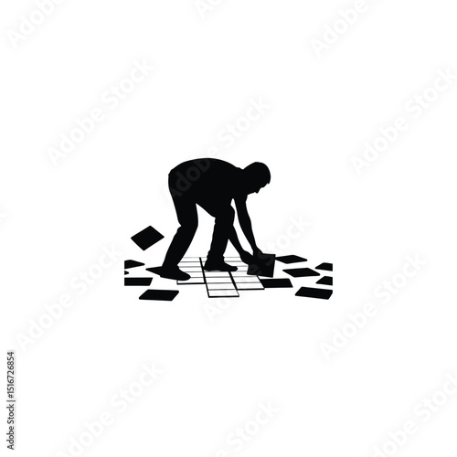 Silhouette of a worker laying ceramic floor tiles on white background