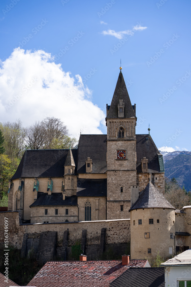 Church of St. Oswald, built in Gothic style against the sky, Eisenerz, Austria Church of St. Oswald, built in Gothic style against the sky, Eisenerz, Austria