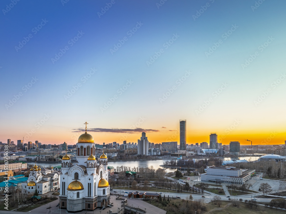 Obraz premium Early spring or autumn Yekaterinburg and Temple on Blood in clear sunset. Aerial view of Yekaterinburg, Russia. Translation of the text on the temple: Honest to the Lord is the death of His saints.