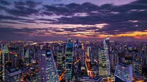 Wallpaper Mural Nightfall cityscape panorama showcasing illuminated skyscrapers and a vibrant sunset sky. Torontodigital.ca