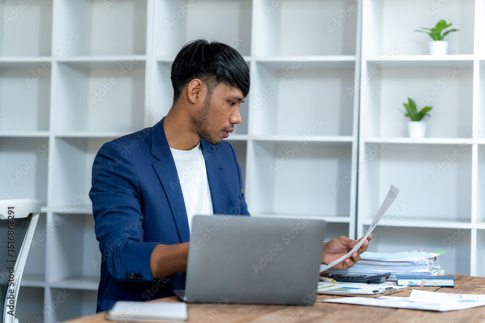 Fototapeta premium Focused Businessman Working at Desk