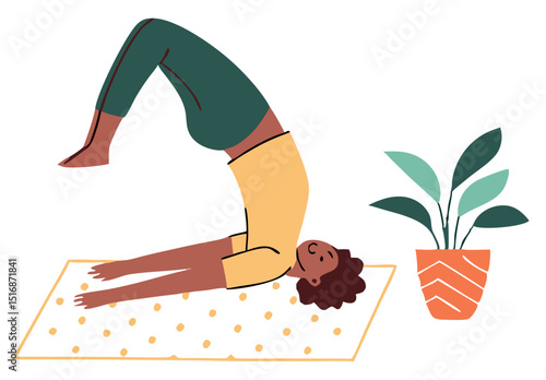 Woman practicing yoga in shoulder stand pose with plant