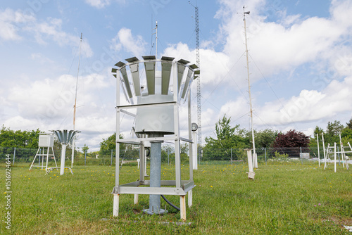 Fototapeta Meteorological station with rain gauge collectors and weather sensors installed