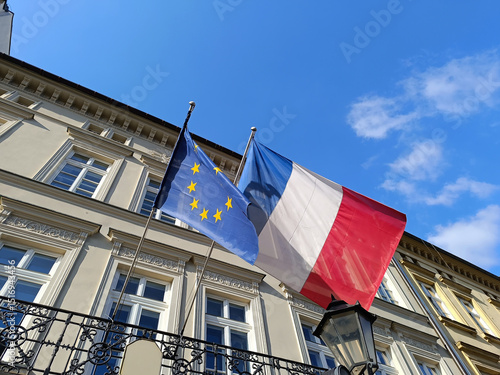 Photos European Union and French Flags Waving on Historical Building under Blue Sky