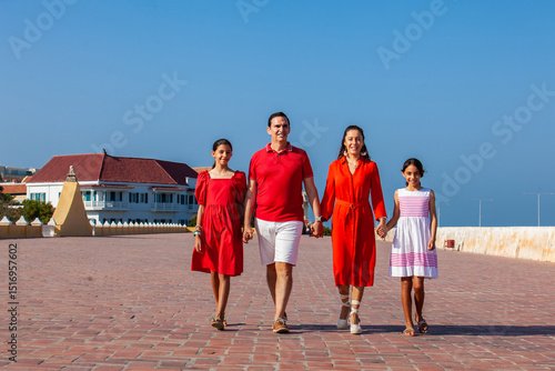 Young family of four traveling together. Family love concept. Travel concept. Cartagena de Indias.