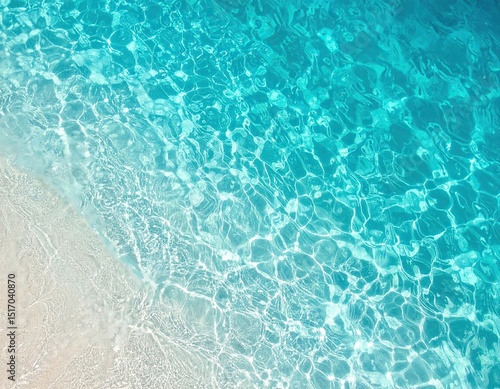 Turquoise water meets sandy shore