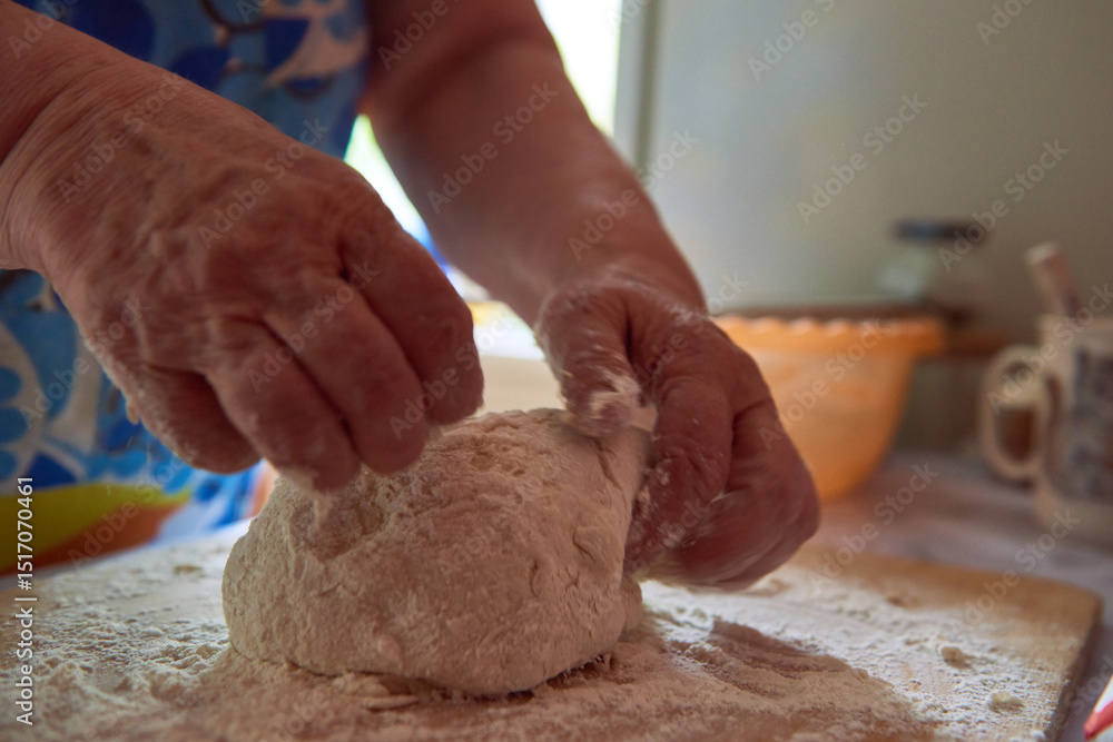 Fototapeta premium Female hands and dough. Making bread.