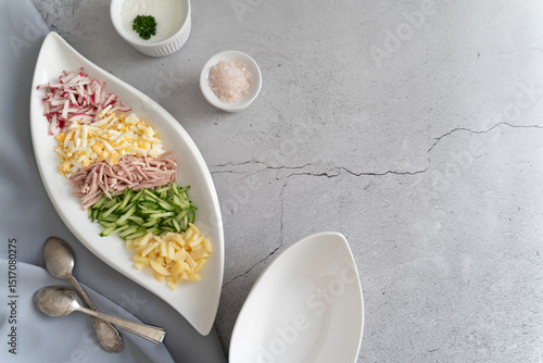 Prepared ingredients ready to be mixed in okroshka