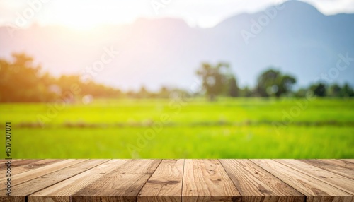 Wooden table in front of a blurred green rice paddy landscape