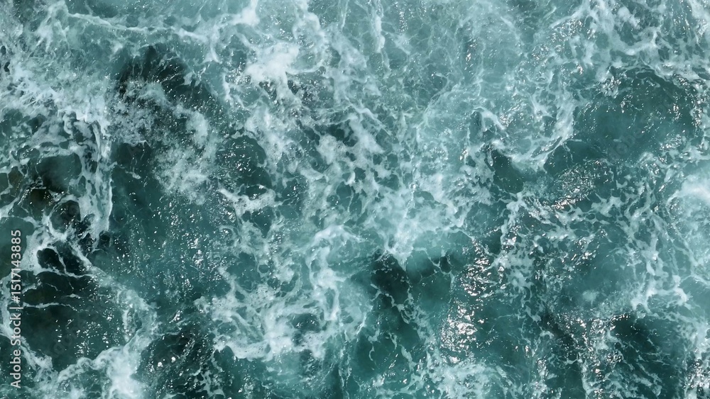 Naklejka premium An aerial view highlights the epic power of the ocean, with massive waves breaking over the rocky shore, each crash a spectacular force of nature. Thailand. 