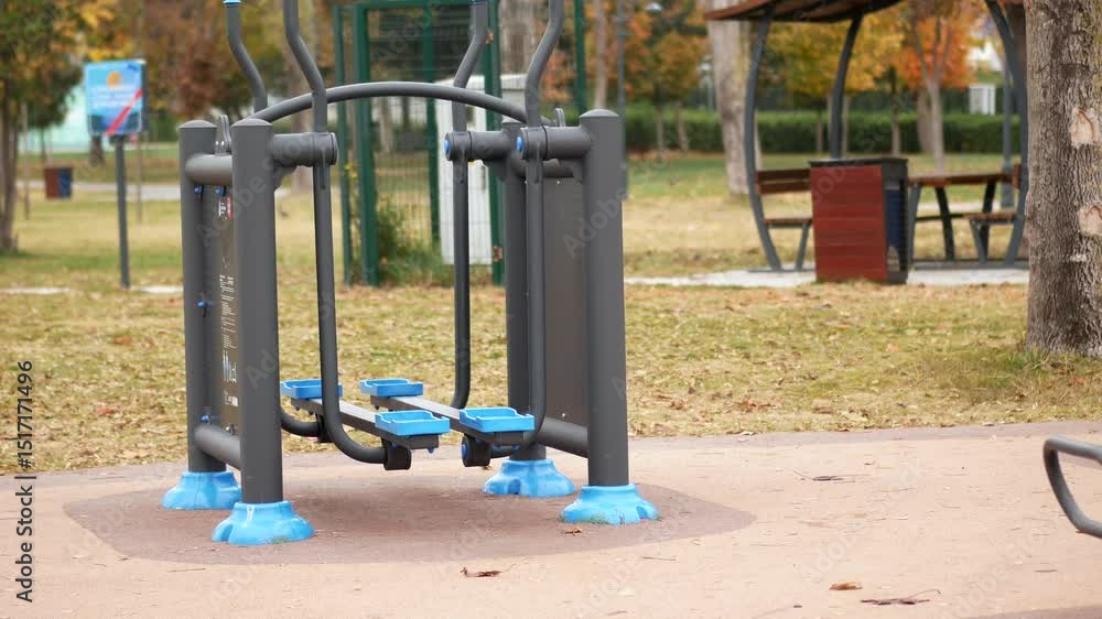Outdoor fitness area in park encourages healthy activities Outdoor fitness area in park encourages healthy activities