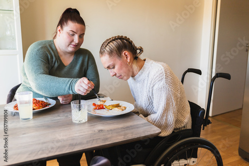 Caring Mealtime Assistance for Young Woman in Wheelchair