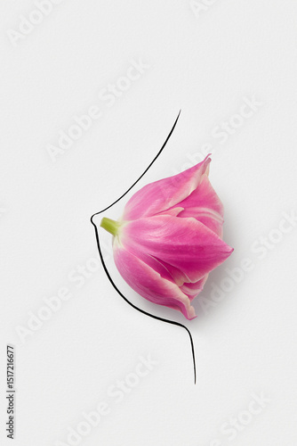 Pink flower bud with petals arranged on hand drawn female breast
