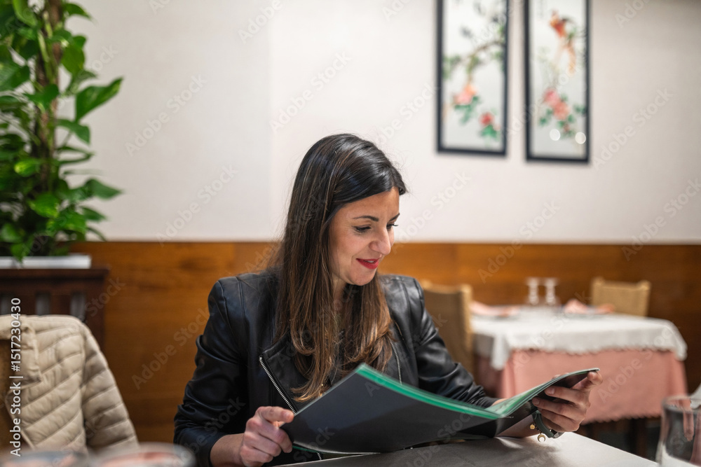Young woman reading menu at Chinese restaurant Young woman reading menu at Chinese restaurant
