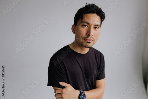 Wallpaper Mural Portrait of a Confident Young Man in Casual Clothing in Studio Setting Torontodigital.ca