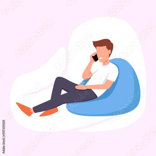 man on the phone and sitting on a bean bag