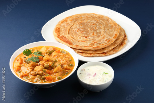 Malabar parotta with Kurma is a delicacy from the state of Kerala, Tamilnadu. Kurma is mixed veg south Indian curry with coconut milk