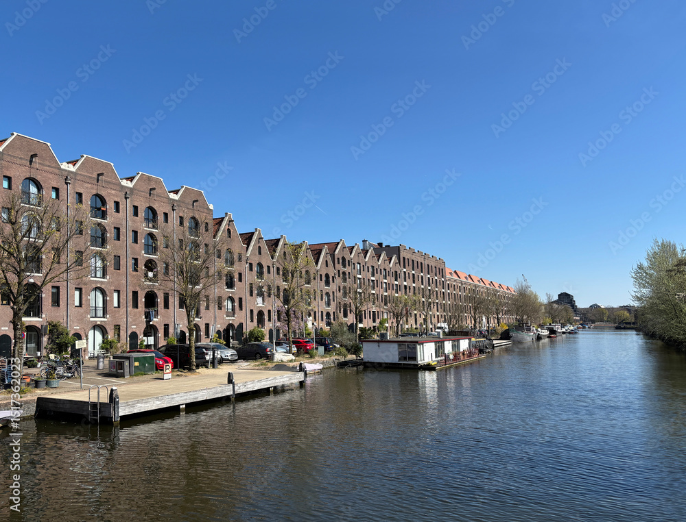 warehouses along an Amsterdam canal warehouses along an Amsterdam canal