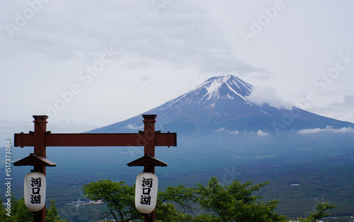 Majestic Mount Fuji View: Gaze upon the iconic snow-capped peak of Mount Fuji, framed by a classic Japanese lantern and surrounded by serene landscape