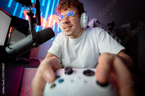 Closeup of a gamer playing intense video game on gaming controller