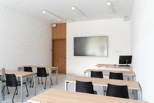 Modern Bright Classroom with Desks And Interactive Whiteboard

