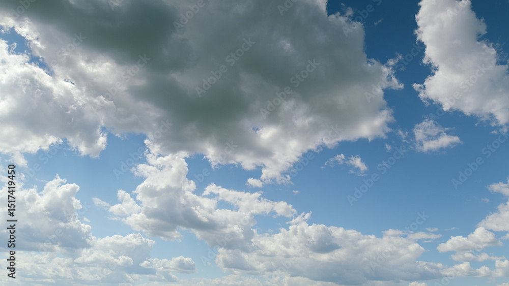 Obraz premium The Expansive Sky Displaying Fluffy Clouds An AweInspiring Wonder in Natures Beauty Time lapse.
