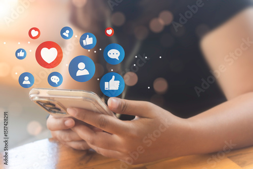 Woman hand hold smartphone and use social media network application to check new feedback or interactive with people and send emoticon for  react feeling and moment.