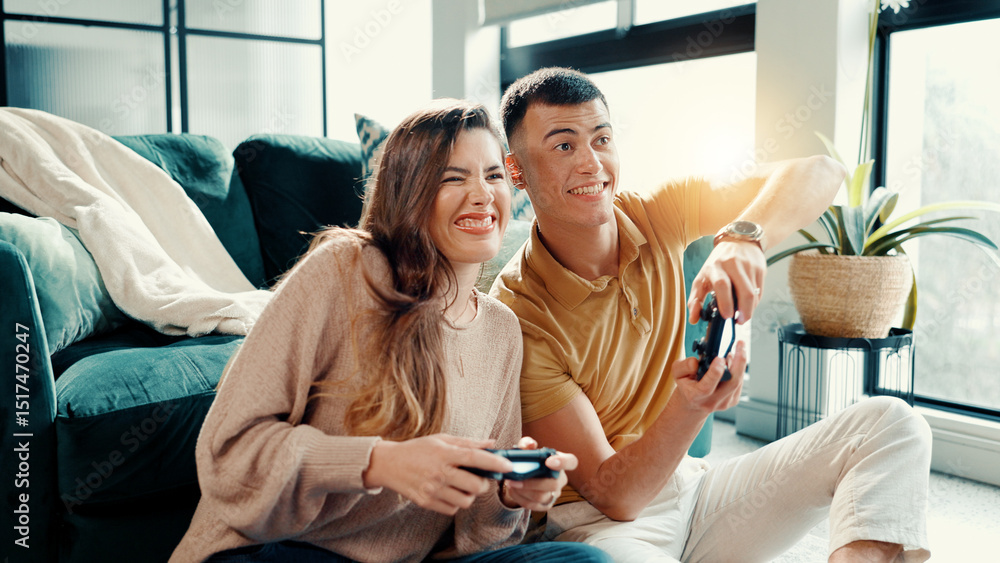 Obraz premium Competition, gamer couple and having fun in living room of home together for bonding or dating. Challenge, remote controller and video game with people in apartment for entertainment or relationship