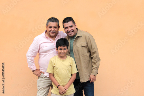 Konstfotografi Three generations of a dark-skinned Latino grandfather, father, and son show the
