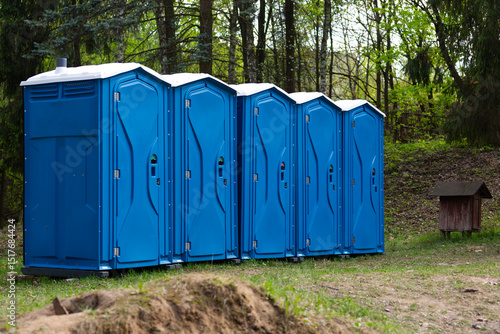 Biotoilets, mobile toilet cabins in a public park.