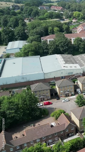 Wallpaper Mural Topdown aerial footage of Kent townscape with residential roofs, streets, and trees visible Torontodigital.ca