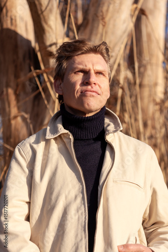 Wallpaper Mural Contemplative mature man wearing turtleneck looking away Torontodigital.ca