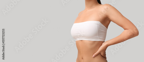 Young woman in bandeau top ...