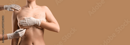 Plastic surgeon marking wom...