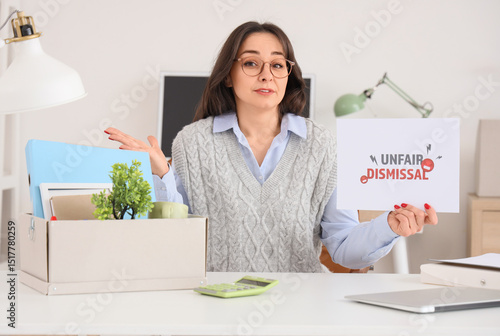 Fired businesswoman holding...