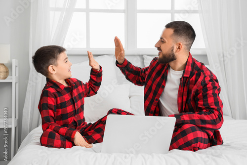 Happy father and his son in...