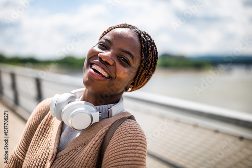Photography Happy young black woman is looking at camera and smiling